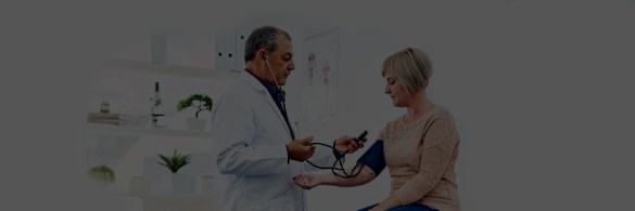 Doctor checking blood pressure