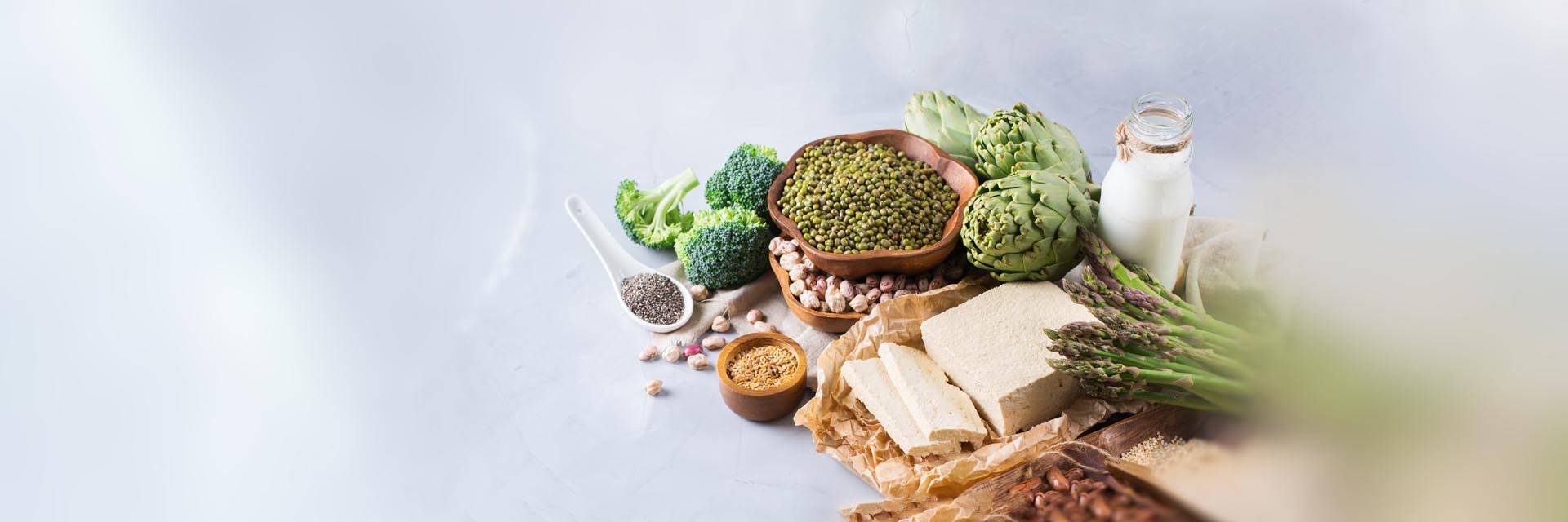 Spread of healthy foods including brocolli, asparagus and chia seeds