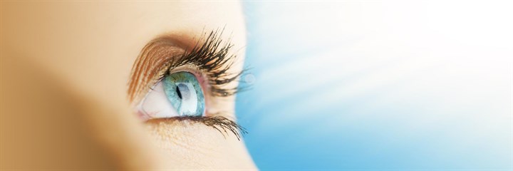 Close-up of blue eye looking towards light