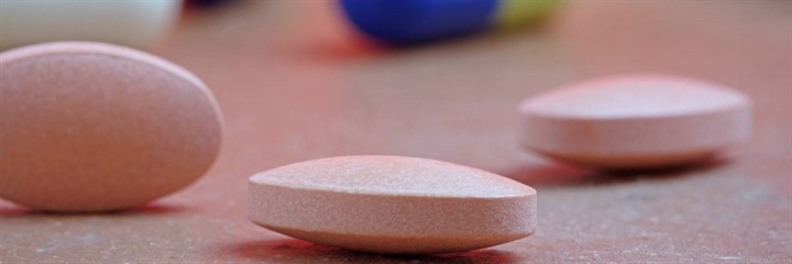 Pink supplement tablets