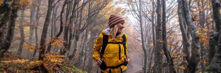 Woman hiking through the woods