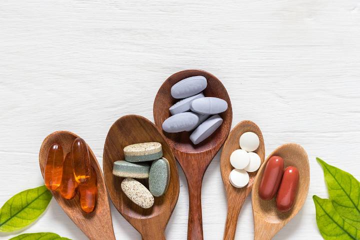 Wooden spoons with various different colour supplements